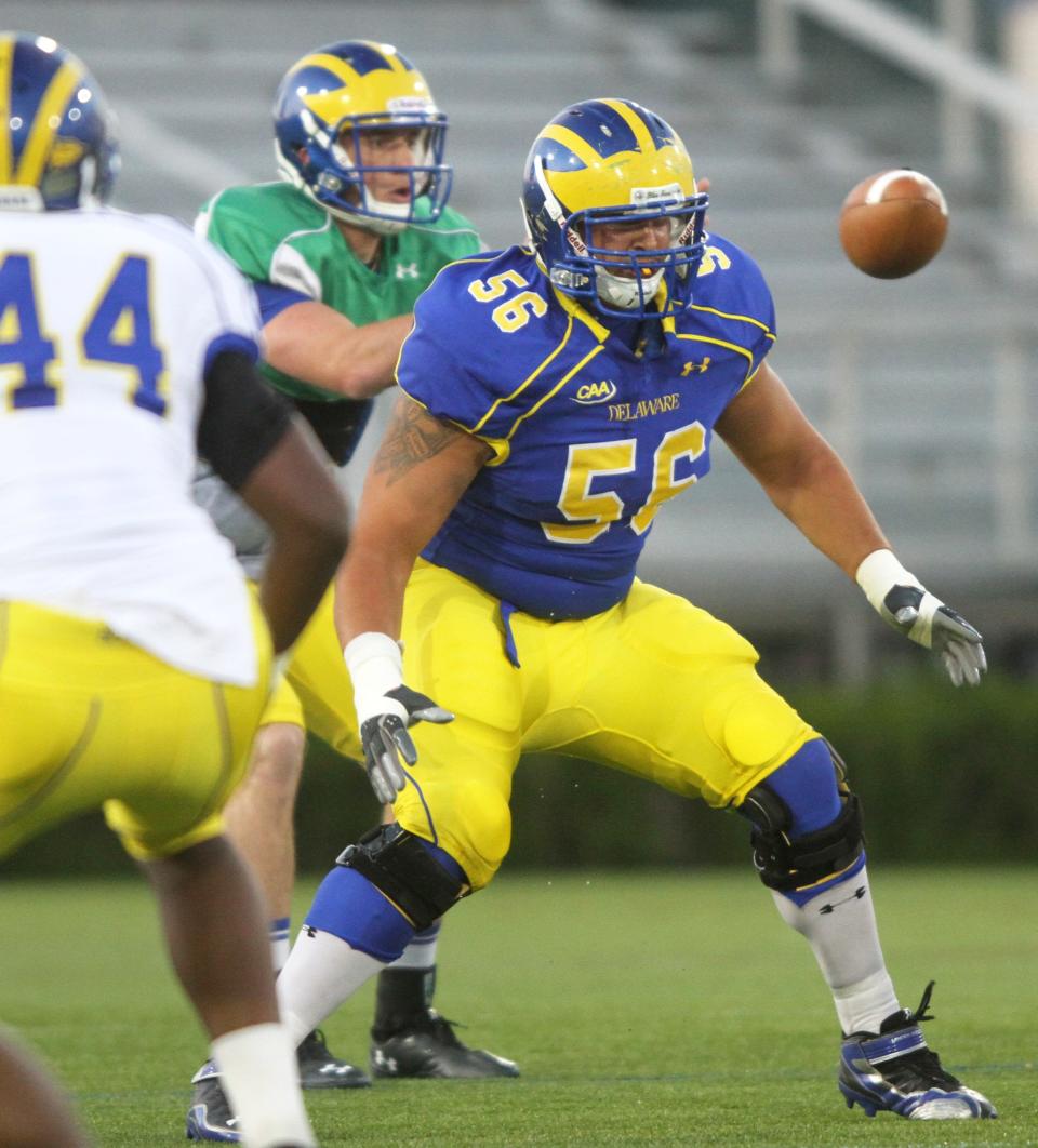 University of Delaware offensive lineman Bobby Kennedy pass sets in a spring scrimmage. In high school at Caravel, Kennedy was among the state's best throwers.