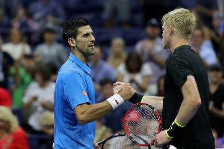 Sep 4, 2016; New York, NY, USA; Novak Djokovic of Serbia (L) shakes hands with Kyle Edmund of Great Britain (R) after their match on day seven of the 2016 U.S. Open tennis tournament at USTA Billie Jean King National Tennis Center. Djokovic won 6-2, 6-1, 6-4. Mandatory Credit: Geoff Burke-USA TODAY Sports