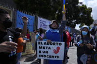 Anti-abortion activists demonstrate outside the National Assembly as lawmakers vote on whether to allow abortion in all cases of rape, in Quito, Ecuador, Thursday, Feb. 17, 2022. Currently, abortion is legal in Ecuador if the mother’s life is in danger or in cases involving the rape of a woman with a mental disability. (AP Photo/Dolores Ochoa)