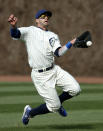 Chicago Cubs right fielder Justin Ruggiano misses the catch on a triple by Arizona Diamondbacks' Aaron Hill, on which two runs scored during the ninth inning of a baseball game at Wrigley Field in Chicago on Wednesday, April 23, 2014. (AP Photo/Andrew A. Nelles)