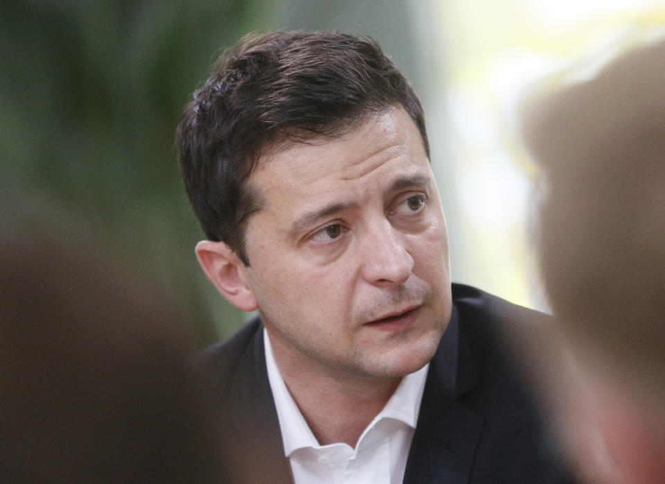 Ukrainian President Volodymyr Zelenskiy talks with journalists in Kyiv, Ukraine, Thursday, Oct. 10, 2019. Ukrainian President is holding an all-day "media marathon" in a Kyiv food court amid growing questions about his actions as president. (AP Photo/Efrem Lukatsky)