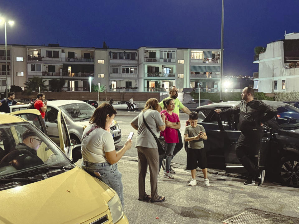 People gather in a street after an earthquake in Campi Flegrei, near Naples, Italy, Tuesday, May 20, 2024. The quake is the strongest ever recorded around the Phlegraean Fields, a sprawling area of ancient volcanic centers near the Tyrrhenian Sea that encompasses western neighborhoods of Naples and its suburbs, said Giuseppe De Natale, a vulcanologist of Italy’s INGV national geophysics and vulcanology center. (Alessandro Garofalo/LaPresse via AP)