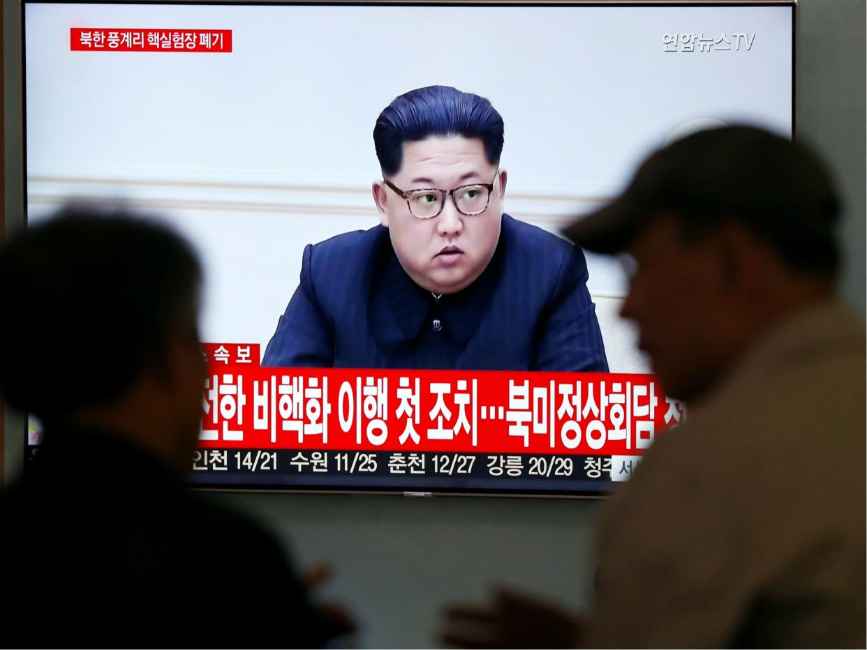 People watch a TV broadcasting a news report of North Korean leader Kim Jong-un, in Seoul, South Korea, 24 May 2018: REUTERS/Kim Hong-Ji