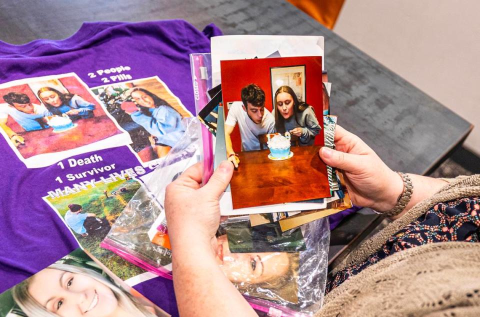Andrea McCutcheon looks at photos of her daughter Valerie Vineyard, who died from a fentanyl poisoning on May 27, 2021 at the age of 19, and her boyfriend Harrison. Vineyard and Harrison were both found unconscious the morning after they decided to take a Percocet pill. Vineyard’s boyfriend survived, but she did not.