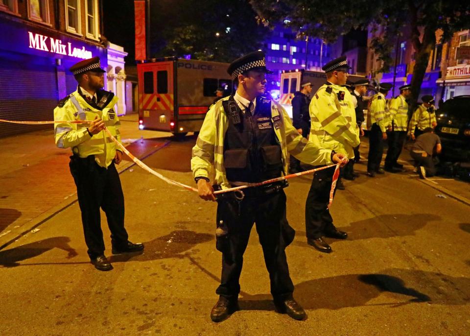 <p>Police officers attend to the scene after a vehicle collided with pedestrians in the Finsbury Park neighborhood of North London, Britain June 19, 2017. (Neil Hall/Reuters) </p>