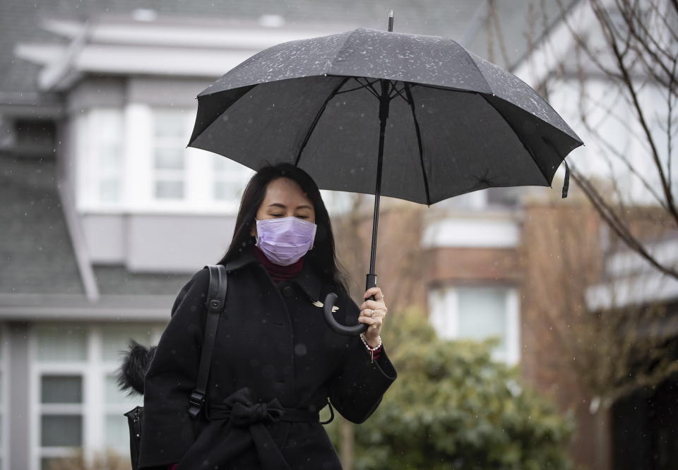 Meng Wanzhou, chief financial officer of Huawei, leaves her home to attend a hearing at B.C. Supreme Court, in Vancouver, B.C., Friday, March 19, 2021. (Darryl Dyck/The Canadian Press via AP)