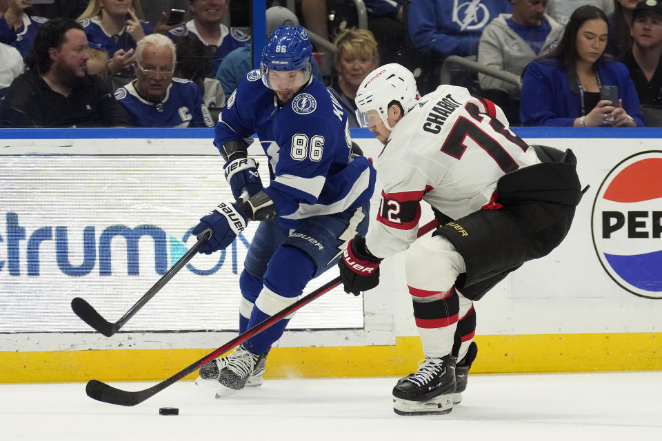 Ottawa Senators defenseman Thomas Chabot (72) steals the puck from Tampa Bay Lightning right wing Nikita Kucherov (86) during the second period of an NHL hockey game Thursday, April 11, 2024, in Tampa, Fla. (AP Photo/Chris O'Meara)