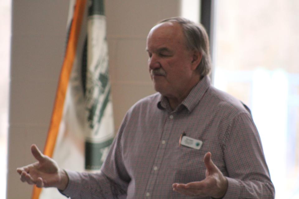 Emmet County Commissioner Rich Ginop leads a prayer at the opening of the Health Department of Northwest Michigan's Board of Health meeting on April 4, 2023.