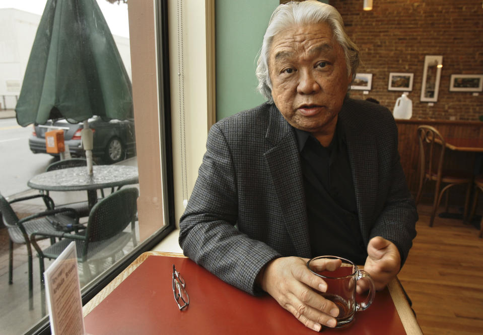 FILE - In this file photo taken Jan. 20, 2011, Glenn Nishimura discusses his health insurance situation at a coffee shop in Little Rock, Ark. As the U.S. Supreme Court prepares to hear arguments on President Barack Obama's health care overhaul, The Associated Press spoke with a variety of people to hear their experiences so far with the landmark legislation, whose major provisions don’t take effect until 2014. Reporters asked: How has the health care law affected your life? Nishimura has been uninsured for nearly three years. He lost his health coverage after he left a full-time position with benefits in 2007, thinking he could land another good job. The recession destroyed that plan. He’s been denied coverage because of high blood pressure and high blood-sugar levels. A provision in the national health care law gave his state $46 million to insure people like him who've been denied coverage because of pre-existing conditions. But Nishimura said he can’t afford the coverage. It would cost him about $6,300 a year in premiums with a $1,000 deductible, meaning he would pay the first $1,000 out of his own pocket before coverage kicks in. (AP Photo/Danny Johnston, File)