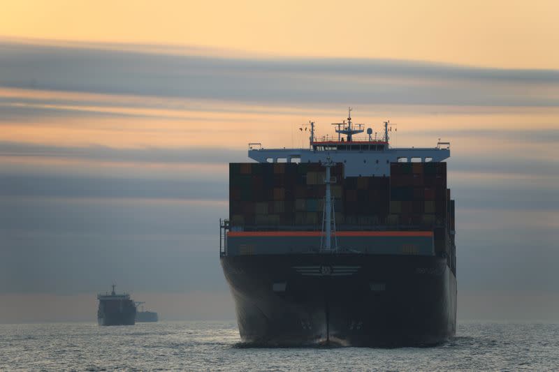 Cargo ship carrying containers approaches a port in Ningbo