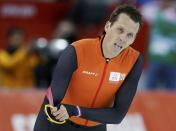 Stefan Groothuis of the Netherlands reacts after the men's 1,000 metres speed skating race at the Adler Arena during the 2014 Sochi Winter Olympics February 12, 2014. REUTERS/Phil Noble (RUSSIA - Tags: OLYMPICS SPORT SPEED SKATING)