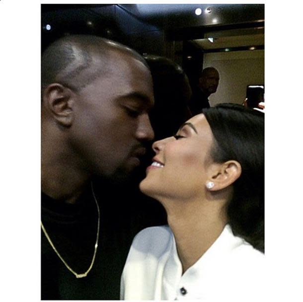 kim karashian kisses kanye west.