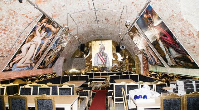 The underground establishment is lined with gigantic oil paintings hanging from the ceiling. Source: Vice