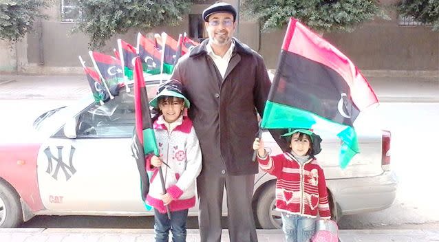 Sotloff poses with two children in Libya in 2013. Photo: Facebook.