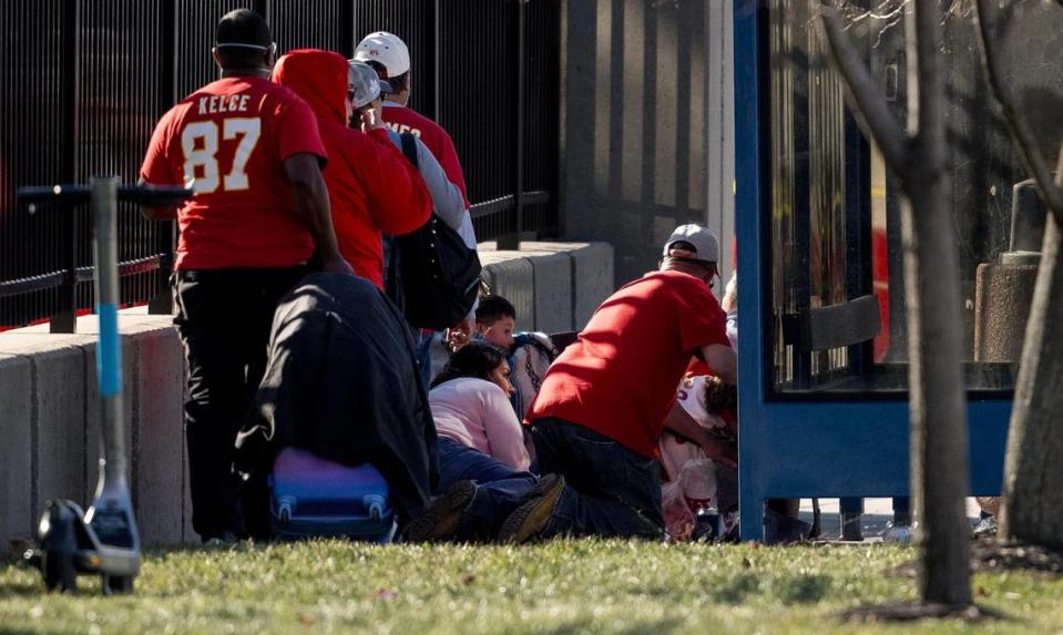 People take cover after a shooting broke out following the Kansas City Chiefs Super Bowl LVIII victory parade on Wednesday, Feb. 14, 2024, in Kansas City.