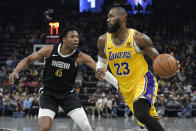 Los Angeles Lakers forward LeBron James (23) drives against Memphis Grizzlies forward GG Jackson II (45) during the first half of an NBA basketball game Wednesday, March 27, 2024, in Memphis, Tenn. (AP Photo/Brandon Dill)