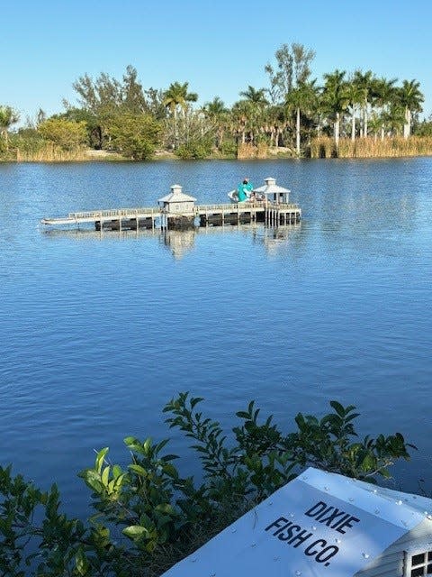 The model of the Fort Myers Beach pier at Lakes Park in Fort Myers was damaged during Hurricane Ian on Sept. 28, 2022. A team of volunteers at the park repaired the model along with other models of iconic Fort Myers landmarks. This photo was taken after Ian. The model of the pier ended up in the middle of the lake.