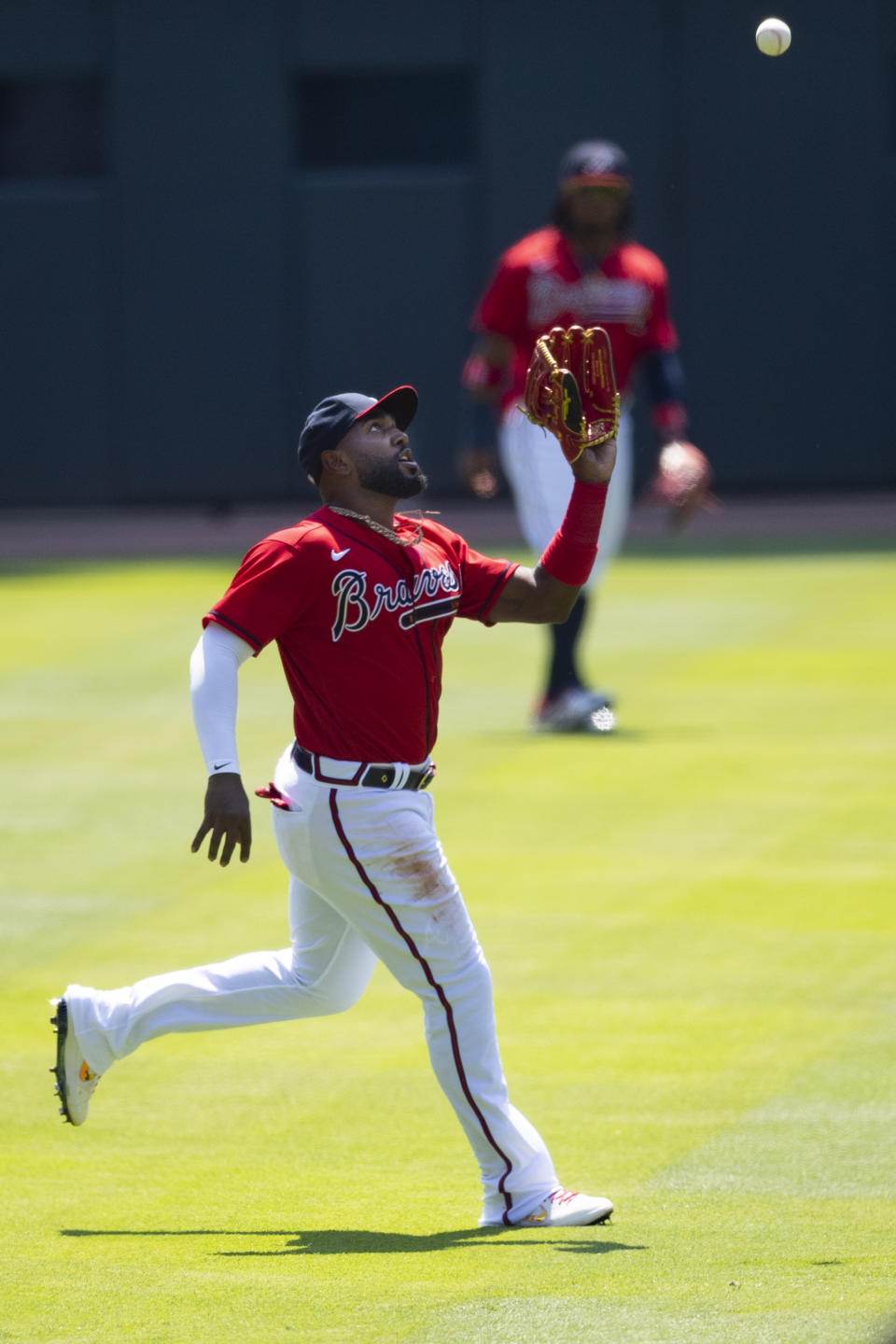Atlanta Braves left fielder Marcell Ozuna catches a fly ball hit by Washington Nationals' Adam Eaton during the first inning of a baseball game Sunday, Sept. 6, 2020, in Atlanta.(AP Photo/John Amis)