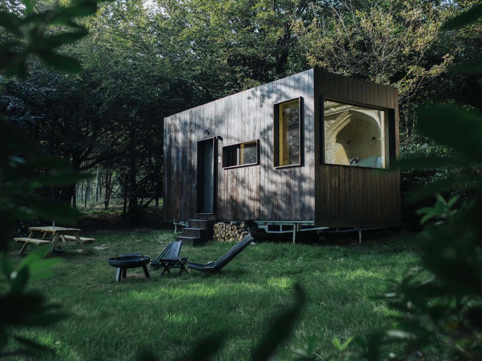 A photograph of an Unplugged cabin in the woods