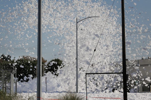 Sea of foam from California airport hangar engulfs streets