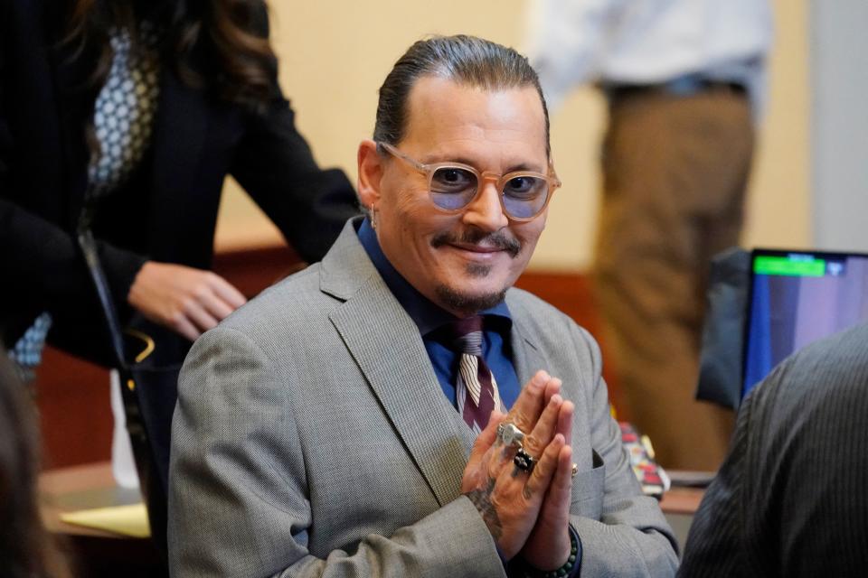 Actor Johnny Depp arrives into the courtroom at the Fairfax County Circuit Courthouse in Fairfax, Virginia, on May 16, 2022. - Actor Johnny Depp sued his ex-wife Amber Heard for libel in Fairfax County Circuit Court after she wrote an op-ed piece in The Washington Post in 2018 referring to herself as a 