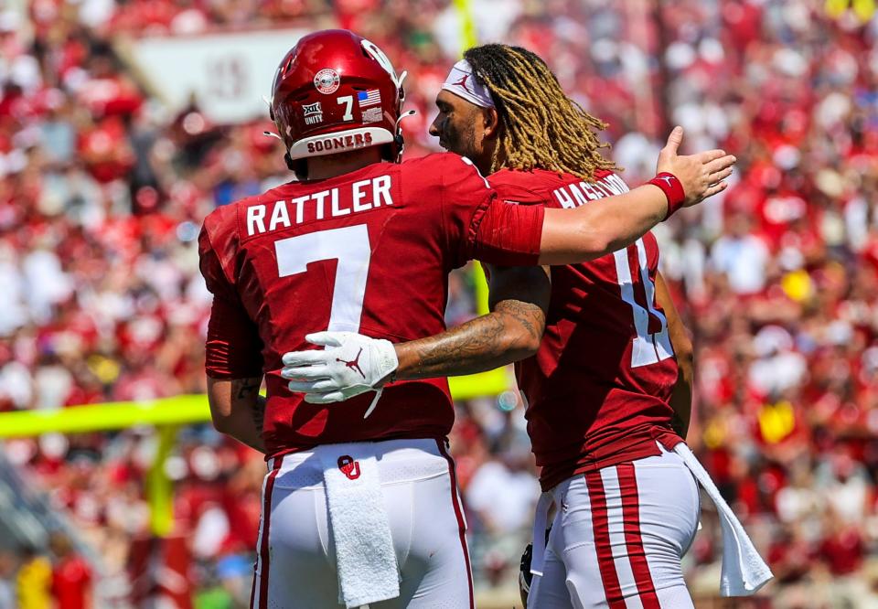 Sooners quarterback Spencer Rattler celebrates with wide receiver Jadon Haselwood during the third quarter against the Cornhuskers.
