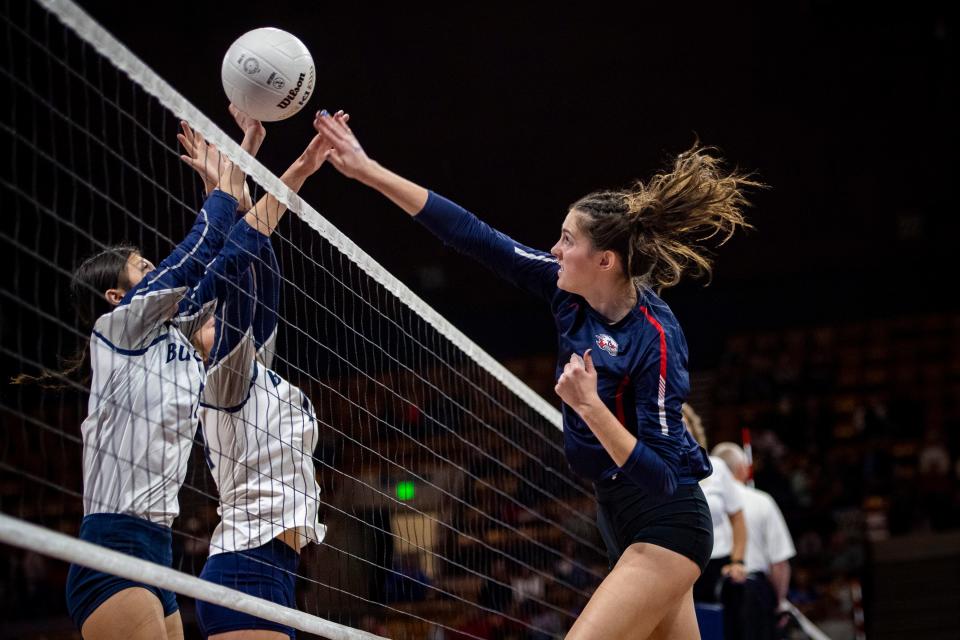 Liberty Common High School's Reina Krueger spikes the ball against University High School during the first round of the Class 3A volleyball state tournament at the Denver Coliseum in Denver, Colo., on Thursday, Nov. 10, 2022.
