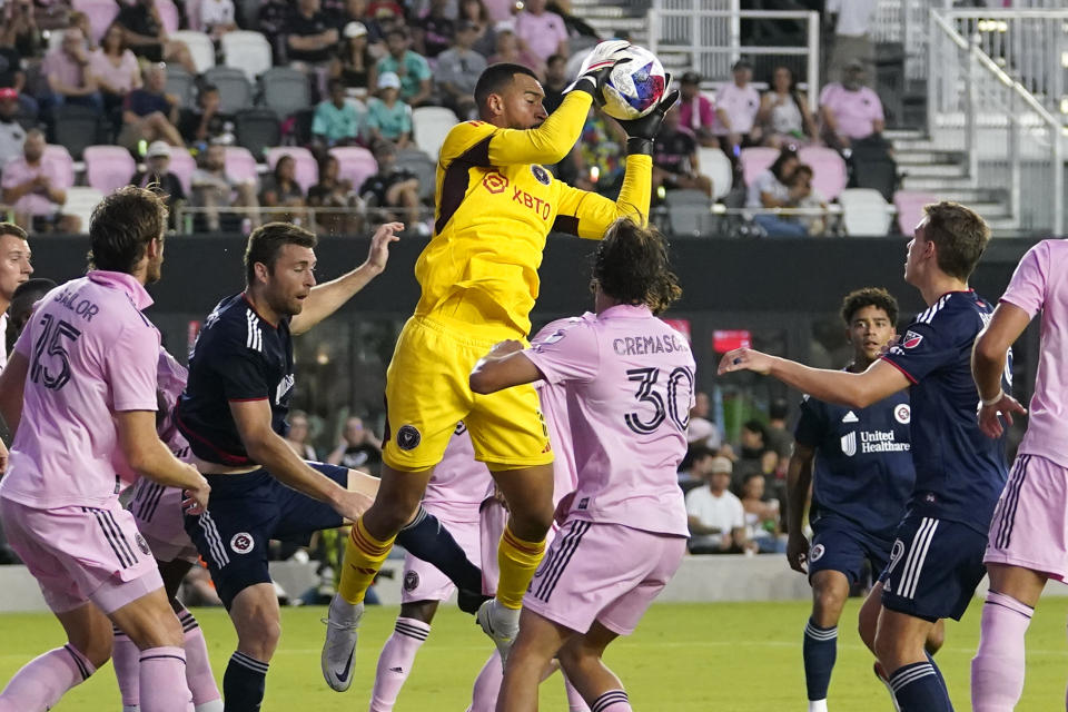 Inter Miami goalkeeper Drake Callender, center, makes a save during the first half of the team's MLS soccer match against the New England Revolution, Saturday, May 13, 2023, in Fort Lauderdale, Fla. (AP Photo/Lynne Sladky)