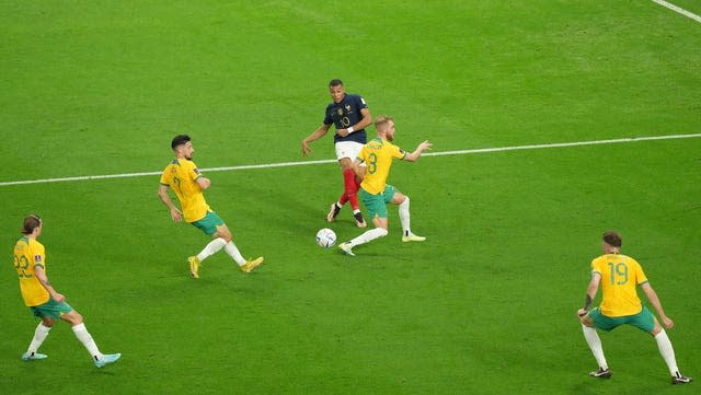 Kylian Mbappe takes on Nathaniel Atkinson and the Australia defence