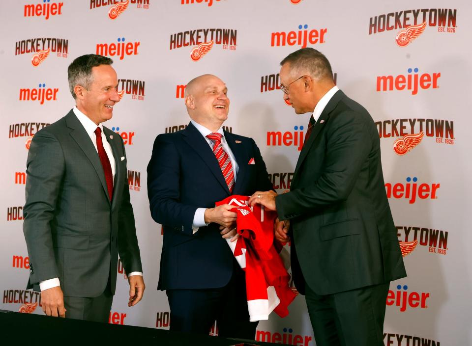 Left to right: Red Wings owner Christopher Ilitch, new Red Wings head coach Derek Lalonde and general manager Steve Yzerman at Little Caesars Arena in Detroit on Friday, July 1, 2022.