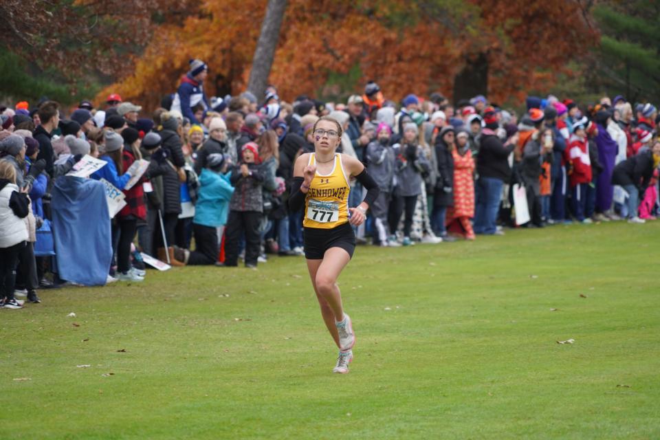 New Berlin Eisenhower's Faith Wehrman looks up at the scoreboard as she nears a sixth-place finish at the WIAA Division 2 girls cross country race at The Ridges Golf Course in Wisconsin Rapids on Saturday Oct. 28, 2023.