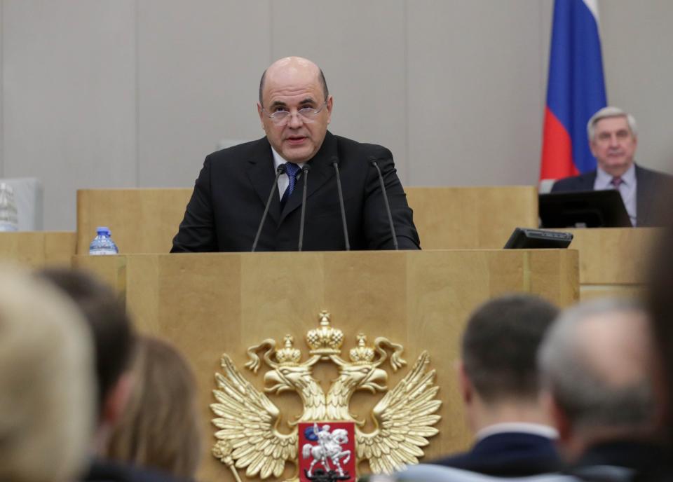 In this photo provided by The State Duma, The Federal Assembly of The Russian Federation, Russian Tax Service chief Mikhail Mishustin, center, who was nominated to replace Medvedev, speaks during a session at the State Duma, the Lower House of the Russian Parliament in Moscow, Russia, Thursday, Jan. 16, 2020. Lawmakers in Russia are set to vote on the appointment of a new prime minister a day after President Vladimir Putin kicked off an unexpected reshuffle of his inner circle. (The State Duma, The Federal Assembly of The Russian Federation via AP)