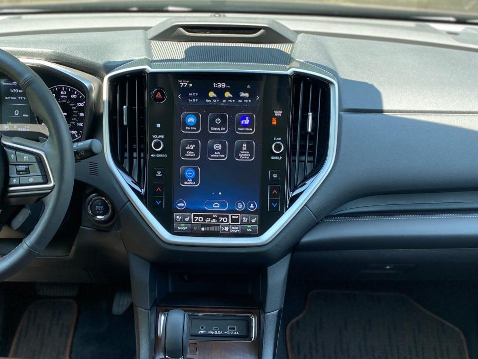 The 2024 Subaru Ascent's front dash features an 11.6-inch infotainment screen and is trimmed in black leather.
