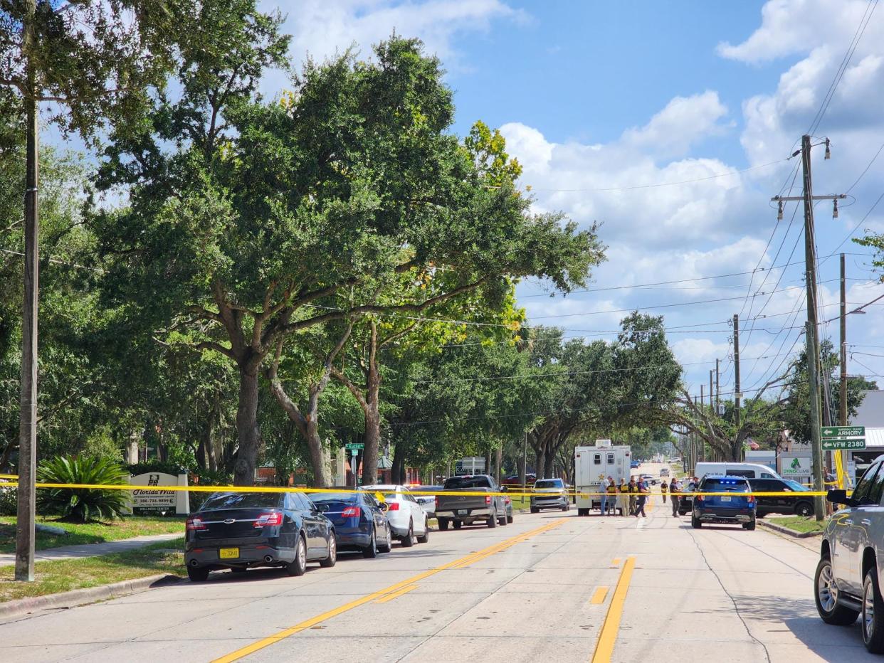 A heavy police presence is seen in the area of Woodland Boulevard and Euclid Avenue in DeLand on Friday.