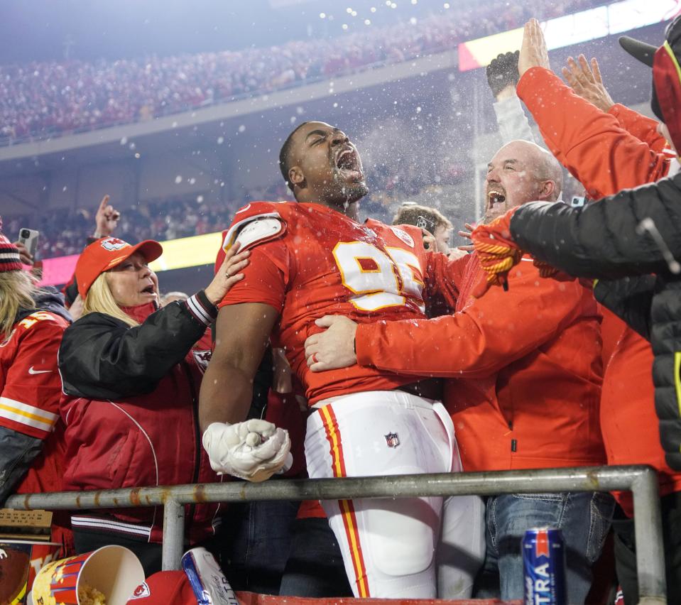 Jan 23, 2022; Kansas City, Missouri, USA; Kansas City Chiefs defensive end Chris Jones (95) celebrates with fans in the stands after the win over the Buffalo Bills a AFC Divisional playoff football game at GEHA Field at Arrowhead Stadium. Mandatory Credit: Denny Medley-USA TODAY Sports