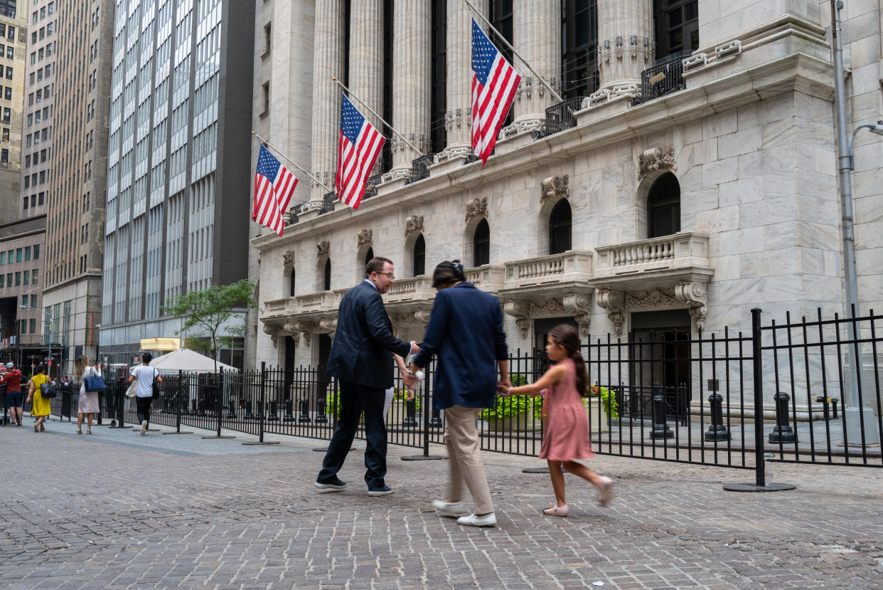 NEW YORK, NEW YORK - JULY 25: People walk outside of the New York Stock Exchange (NYSE) on July 25, 2022 in New York City. Stocks rose slightly in morning trading as investors weigh the upcoming Federal Reserve meeting this coming Wednesday. (Photo by Spencer Platt/Getty Images)