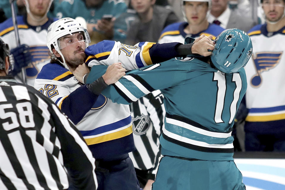 San Jose Sharks center Luke Kunin (11) and St. Louis Blues defenseman Justin Faulk (72) fight in the second period of an NHL hockey game in San Jose, Calif., Saturday, April 6, 2024. (AP Photo/Scot Tucker)