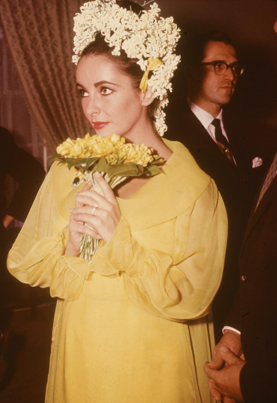 Elizabeth Taylor wore a yellow wedding dress to her 1964 wedding to Richard Burton.