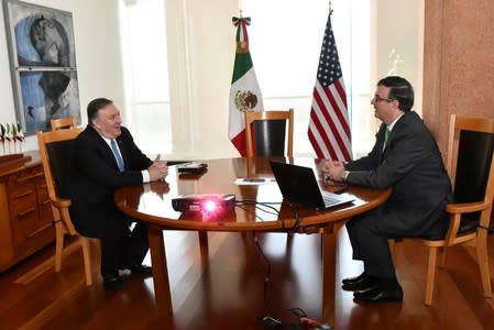 U.S Secretary of State Mike Pompeo speaks with Mexican Foreign Minister Marcelo Ebrard during a private meeting at the Foreign Ministry Building (SRE) in Mexico City