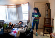 FILE PHOTO: Sincere Bell, 12, chats with his mother, Leanne Bell, 39, surrounded by moving boxes at the army base housing allocated to their family in Fort Hood, Texas, U.S. May 16, 2019. Bell and her husband, Spc. Tevin Mosley, 26, say they are vacating the home immediately after Mosley's military service contract expires in May. The family says they have experienced severe breathing issues, rashes, depression and hair loss, they believe is attributed to a mold infestation since moving into the home 3 years ago. REUTERS/Amanda Voisard