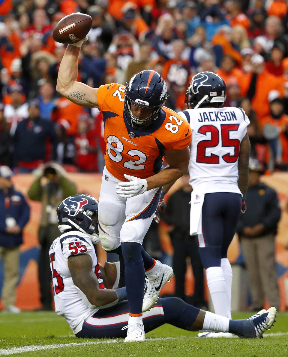 Denver Broncos tight end Jeff Heuerman (82) celebrates his touchdown catch as Houston Texans strong safety Kareem Jackson (25) and inside linebacker Benardrick McKinney (55) look away during the second half of an NFL football game, Sunday, Nov. 4, 2018, in Denver. (AP Photo/Jack Dempsey)