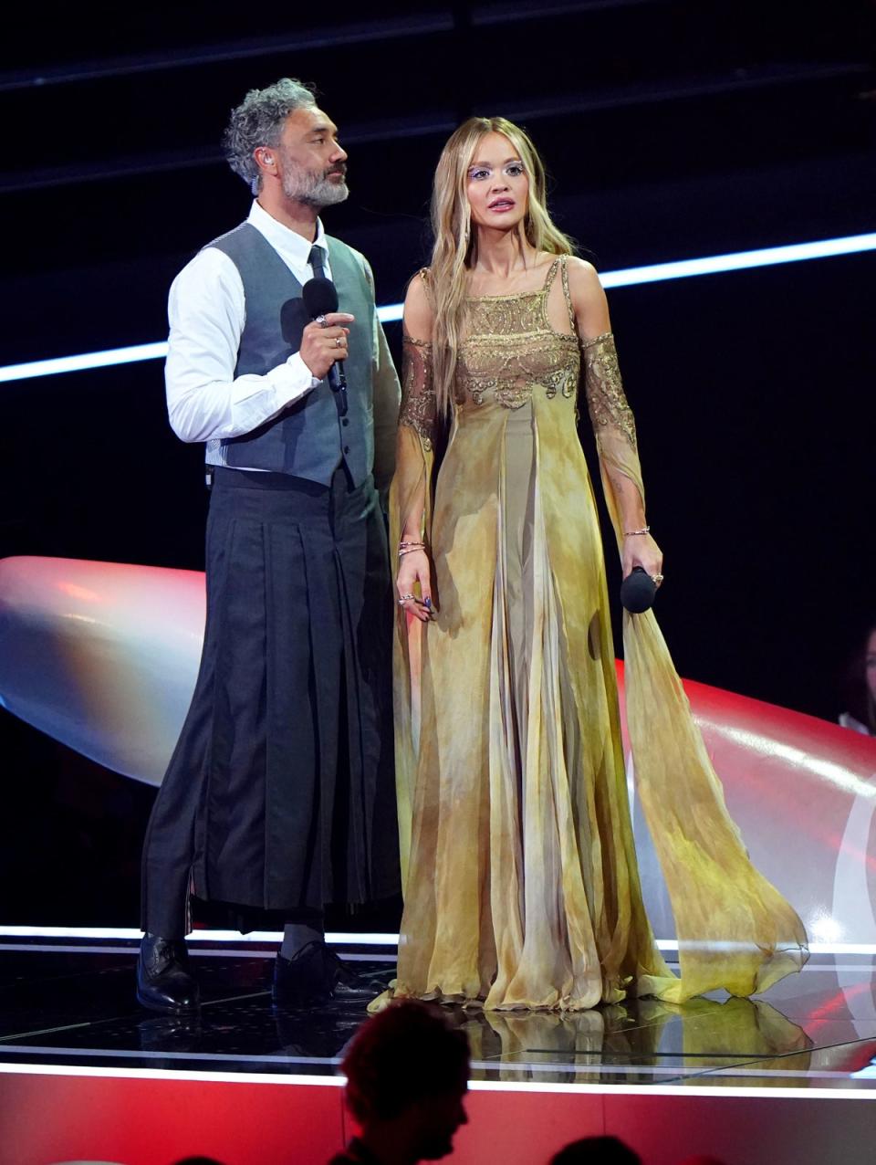 Ora and husband Waititi, pictured on stage at the MTV Europe Music Awards 2022 in Dusseldorf, were pals for over three years before they wed (PA)