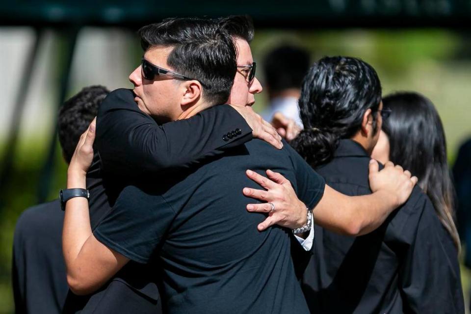 Family and friends gather at the Vista Memorial Gardens cemetery in Miami Lakes on Tuesday, Dec. 10, 2019, for the burial service of Frank Ordonez, the UPS driver who was taken hostage by armed robbers and killed during a shootout with police on Thursday, Dec. 5, 2019.