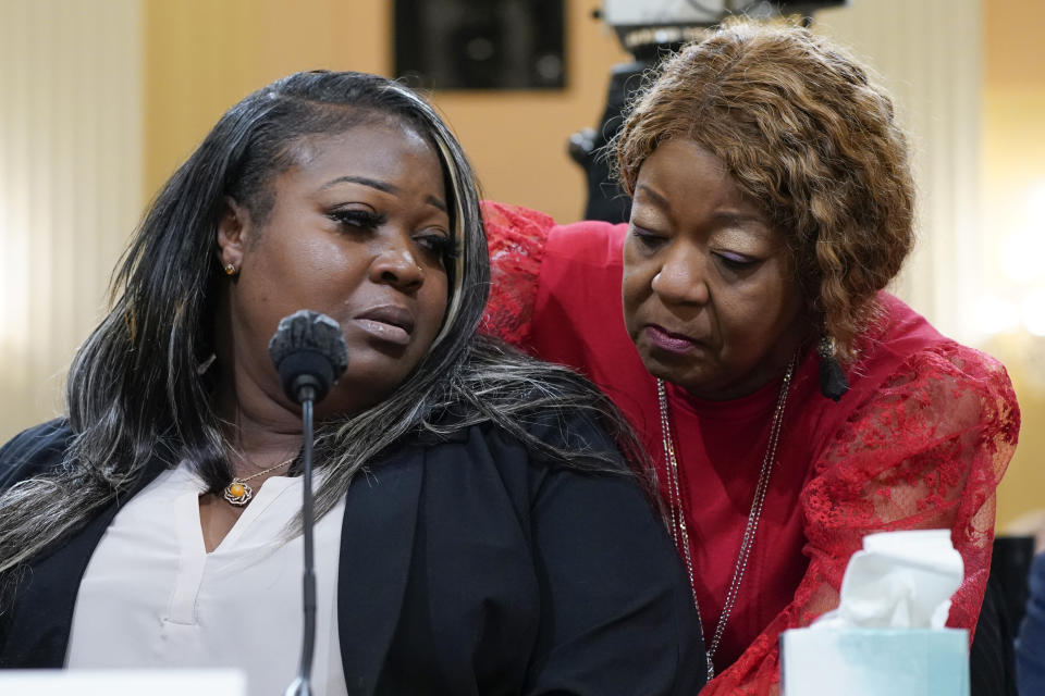 FILE - Wandrea "Shaye" Moss, a former Georgia election worker, is comforted by her mother Ruby Freeman, right, as the House select committee investigating the Jan. 6 attack on the U.S. Capitol continues to reveal its findings of a year-long investigation, at the Capitol in Washington, Tuesday, June 21, 2022. Freeman, a former Georgia election worker suing Rudy Giuliani over false claims he spread about her and her daughter in 2020, cried on the witness stand on Wednesday, Dec. 13, 2023, as she described fleeing her home after she endured racist threats and strangers banging on her door. (AP Photo/Jacquelyn Martin, File)