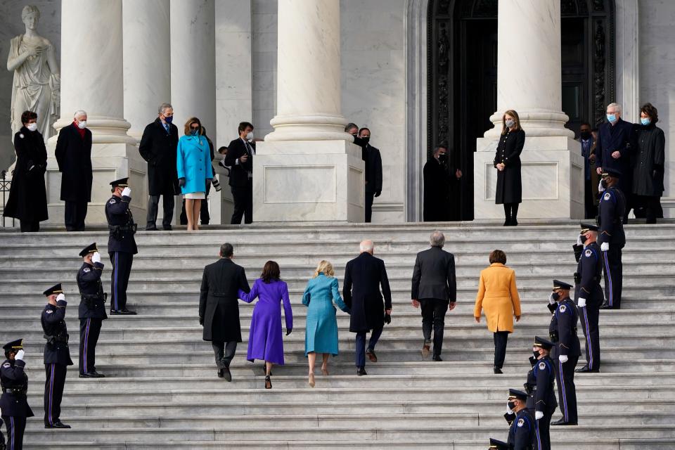 President-elect Joe Biden, his wife Jill Biden and Vice President-elect Kamala Harris and her husband Doug Emhoff arrive at the steps of the U.S. Capitol for the start of the official inauguration ceremonies, in Washington, Wednesday, Jan. 20, 2021. Speaker of the House, Nancy Pelosi waits at left.