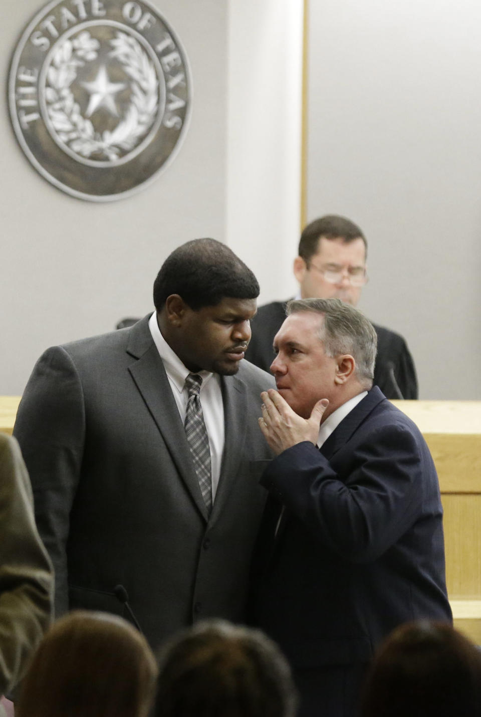 Former Dallas Cowboys' Josh Brent, left, talks with his attorney George Milner during juror selection Friday, Jan. 10, 2014, in Dallas. Jury selection continues for the upcoming trial of Brent, who's accused of killing a practice squad player in a drunken-driving wreck. Opening statements in the case are expected next week. (AP Photo/LM Otero)