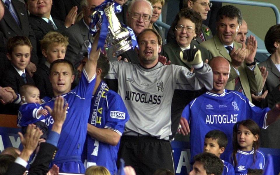 Dennis Wise lifts the FA Cup with his son Henry after defeating Aston Villa in the FA Cup final at Wembley Stadium in 2000 - Rebecca Naden/PA