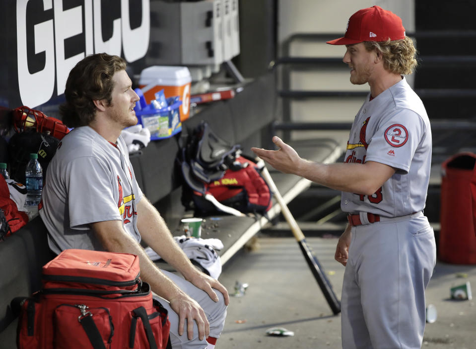 While in Japan, Miles Mikolas (left) learned from his teammates to be more balanced on the mound. (AP)