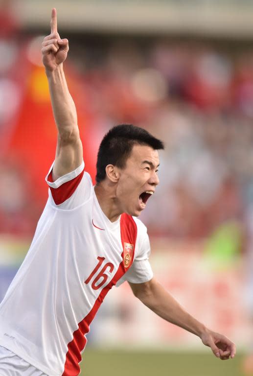 China's Sun Ke celebrates after scoring during the Asian Cup match against North Korea in Canberra on January 18, 2015