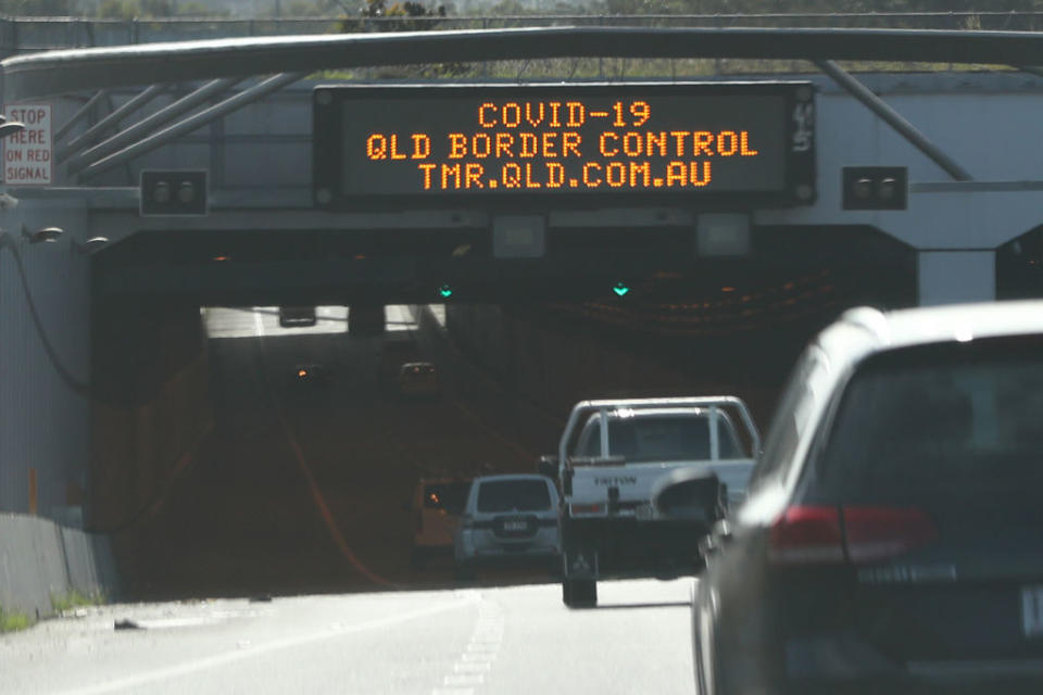 A warning signs on the M1 Motorway at the Queensland Border on Gold Coast warns of border closure for COVID-19.